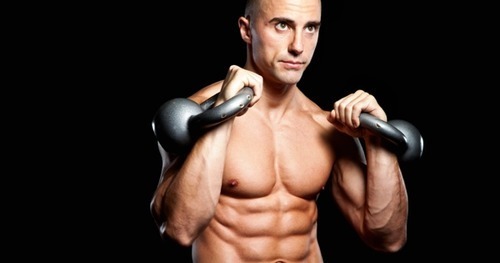 athlete with kettlebells